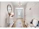 Bright and airy entryway with built-in bench, console table, and mirror at 142 Jade St, Smithfield, NC 27577