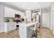 Modern kitchen with white cabinets, quartz countertops, and stainless steel appliances at 142 Jade St, Smithfield, NC 27577