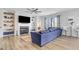 Open living room with fireplace, built-in shelves, and comfortable sectional sofa at 142 Jade St, Smithfield, NC 27577