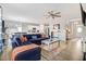 Open concept living area with sectional sofa, hardwood floors, and kitchen views at 142 Jade St, Smithfield, NC 27577