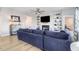 Spacious living area with sectional sofa, built-in shelving, and a fireplace at 142 Jade St, Smithfield, NC 27577