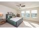 Main bedroom with plush carpet, large windows, and ceiling fan at 1609 Mallard Trace Dr, Wendell, NC 27591
