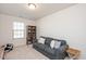 Bedroom with bookcase, couch, and window at 1609 Mallard Trace Dr, Wendell, NC 27591