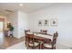 Dining room with oval table, four chairs, and framed botanical prints at 1609 Mallard Trace Dr, Wendell, NC 27591