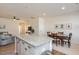 Open kitchen with granite island and seating for three at 1609 Mallard Trace Dr, Wendell, NC 27591