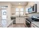 Modern kitchen with granite countertops and stainless steel appliances at 1609 Mallard Trace Dr, Wendell, NC 27591
