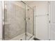 Walk-in shower with glass enclosure and gray tile at 1609 Mallard Trace Dr, Wendell, NC 27591