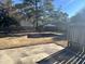View of a backyard with a concrete slab and metal carport at 1641 Bridgedale Dr, Rocky Mount, NC 27803