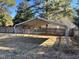 Exterior view of metal carport in backyard with fence and mature trees at 1641 Bridgedale Dr, Rocky Mount, NC 27803