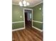 Stylish dining area showcasing hardwood floors, trim detail, and inviting ambiance at 1641 Bridgedale Dr, Rocky Mount, NC 27803