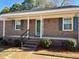 Inviting front porch entry to a brick home at 1641 Bridgedale Dr, Rocky Mount, NC 27803