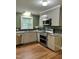 Contemporary kitchen featuring stainless appliances, granite counters, and modern cabinetry at 1641 Bridgedale Dr, Rocky Mount, NC 27803