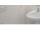Simple bathroom with pedestal sink and white fixtures at 184 Starlight St, Sanford, NC 27330