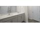 Double vanity bathroom with light gray cabinets at 184 Starlight St, Sanford, NC 27330