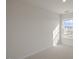 Spacious bedroom with a large window and carpeted floor at 184 Starlight St, Sanford, NC 27330