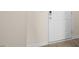 Front entry with white door and wood-look flooring at 184 Starlight St, Sanford, NC 27330
