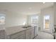 Open concept kitchen with island, granite countertops, and stainless steel appliances at 184 Starlight St, Sanford, NC 27330