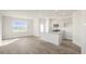 Open concept kitchen and dining area with island and hardwood flooring at 184 Starlight St, Sanford, NC 27330