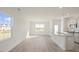 Open concept kitchen and dining area with island and hardwood flooring at 184 Starlight St, Sanford, NC 27330