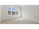 Bright bedroom with large window and plush carpeting at 188 Starlight St, Sanford, NC 27330