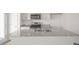 Kitchen island with granite countertops and stainless steel appliances at 200 Starlight St, Sanford, NC 27330