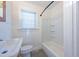 Clean bathroom featuring a tub and neutral wall tiles at 210 Earl St, Rocky Mount, NC 27804