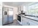 Kitchen boasts stainless steel appliances and white cabinetry at 210 Earl St, Rocky Mount, NC 27804