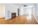 Bright living room with hardwood floors and a brick fireplace at 210 Earl St, Rocky Mount, NC 27804