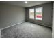 Bright bedroom featuring neutral walls and carpeting at 262 Starry Sky Dr, Benson, NC 27504