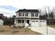 Two-story house with a two-car garage and landscaping at 262 Starry Sky Dr, Benson, NC 27504