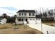 Two-story house with a two-car garage and landscaping at 262 Starry Sky Dr, Benson, NC 27504
