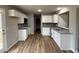 Modern kitchen with white cabinets and granite countertops at 262 Starry Sky Dr, Benson, NC 27504