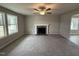 Living room features a fireplace and ceiling fan at 262 Starry Sky Dr, Benson, NC 27504