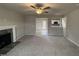Open living area, fireplace, and kitchen view at 262 Starry Sky Dr, Benson, NC 27504