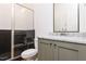 Modern bathroom with green vanity and walk-in shower at 289 Gaines Trl, Pittsboro, NC 27312