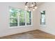 Bright dining room with hardwood floors and large windows at 289 Gaines Trl, Pittsboro, NC 27312