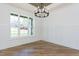 Bright dining room with hardwood floors, wainscoting, and chandelier at 289 Gaines Trl, Pittsboro, NC 27312