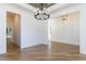 Open concept dining room with hardwood floors and chandelier at 289 Gaines Trl, Pittsboro, NC 27312