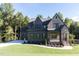 Two-story house with brick and siding, multiple windows, and a landscaped lawn at 289 Gaines Trl, Pittsboro, NC 27312