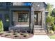 Covered front porch with brick steps and iron railing at 289 Gaines Trl, Pittsboro, NC 27312