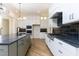 Modern kitchen with stainless steel appliances and dark counters at 289 Gaines Trl, Pittsboro, NC 27312