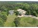Aerial view of the wooded property featuring horse lots and a home at 265 Verde Rd, Apex, NC 27523