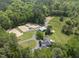 Drone image of the property featuring horse lots and a home at 265 Verde Rd, Apex, NC 27523