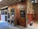 Inside a barn featuring a wood door, stained wood walls, and a built in storage unit at 265 Verde Rd, Apex, NC 27523