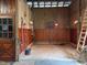 Interior of a barn with a wooden door and stained wood paneling at 265 Verde Rd, Apex, NC 27523