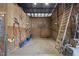 Well-lit horse stall with concrete flooring and wooden walls for a comfortable environment at 265 Verde Rd, Apex, NC 27523