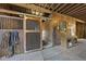 Interior view of the horse barn, showcasing the stalls and accessories at 265 Verde Rd, Apex, NC 27523