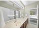 Bathroom featuring double sinks and an enclosed bathtub at 265 Verde Rd, Apex, NC 27523