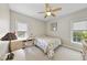 Bright bedroom with a double bed, desk and chair, and ceiling fan at 265 Verde Rd, Apex, NC 27523
