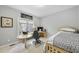 Well-lit bedroom featuring desk, streamlined furniture and a comfortable bed at 265 Verde Rd, Apex, NC 27523